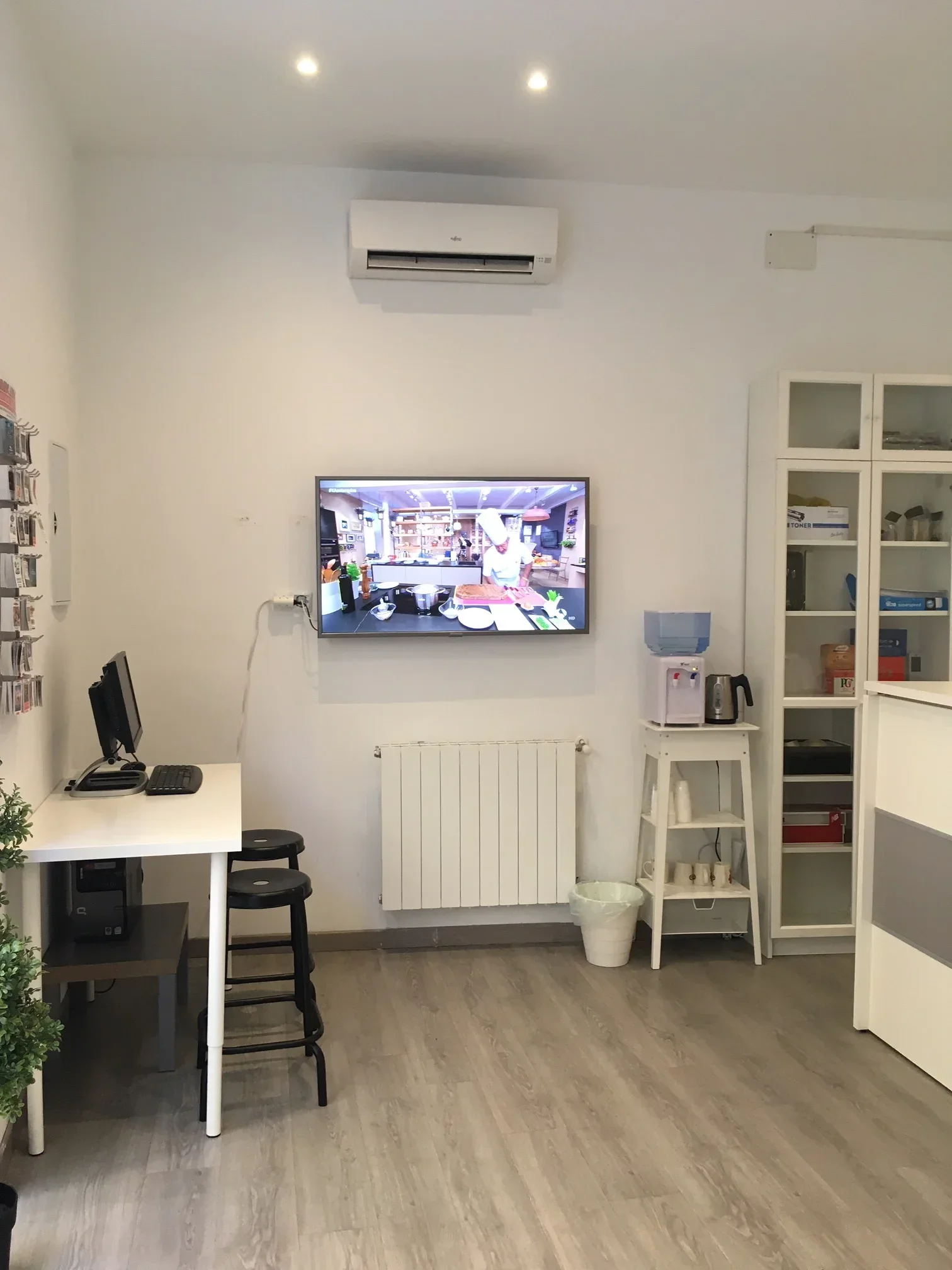 Tidy waiting area with contemporary design and recessed ceiling lights