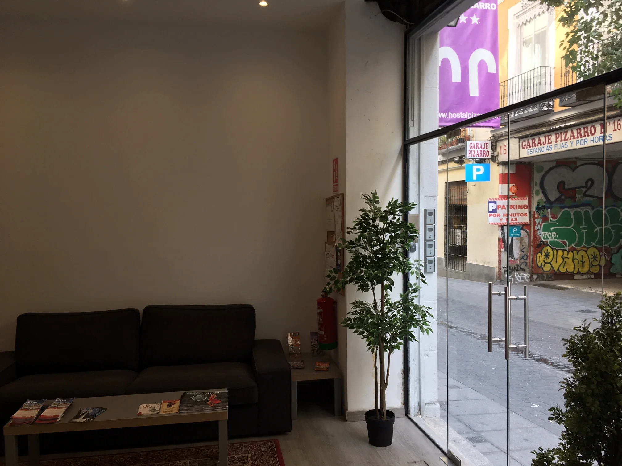 Reception lounge with dark sofa and minimalist decor