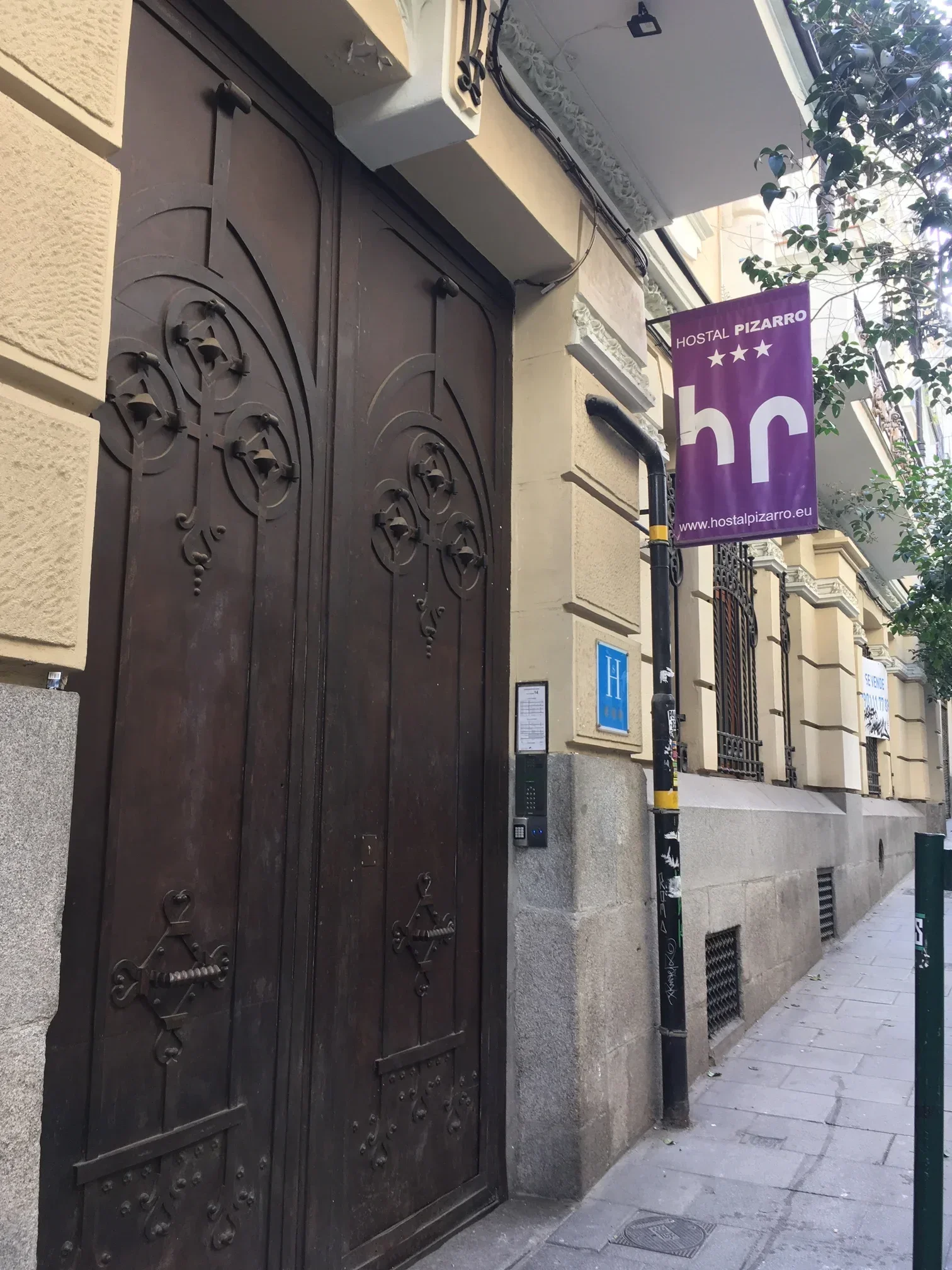 Historic building entrance with dark wooden double doors